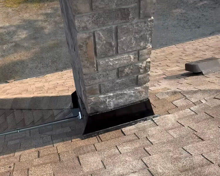 Finished chimney flashing on a steep roof
